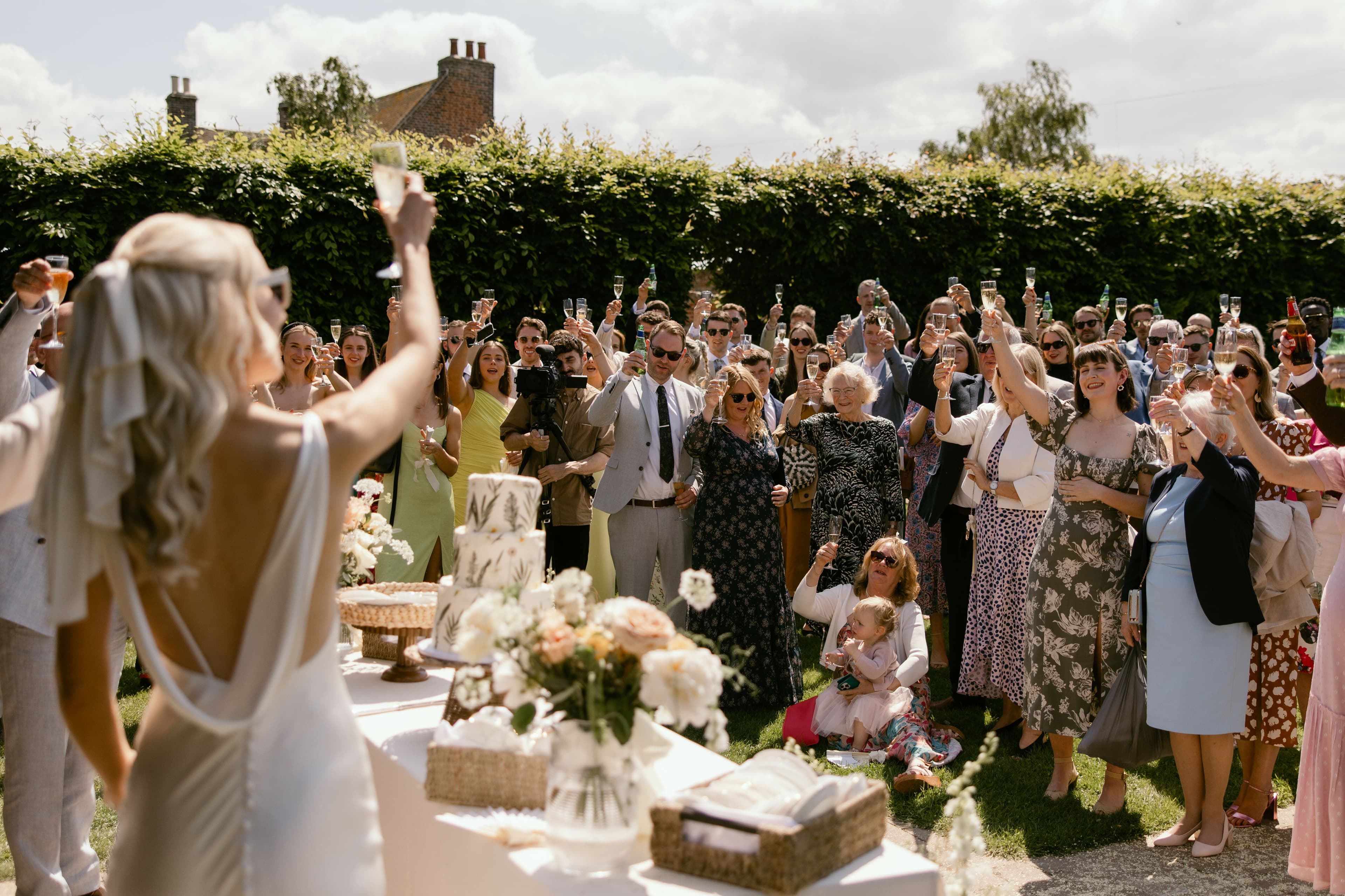 Drinks reception in the Linhay at exclusive-use destination wedding venue near London